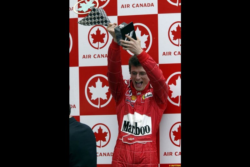 Race Engineer Chris Dyer, Ferrari, celebrates the team victory. Canadian Grand Prix, Montreal, Sunday, June 15th 2003.