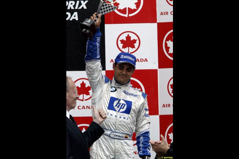 Juan Pablo Montoya, Williams, celebrates third place. Canadian Grand Prix, Montreal, Sunday, June 15th 2003. 
