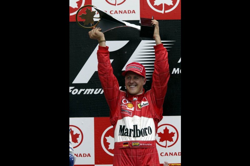 Michael Schumacher, Ferrari, celebrates victory. Canadian Grand Prix, Montreal, Sunday, June 15th 2003.
