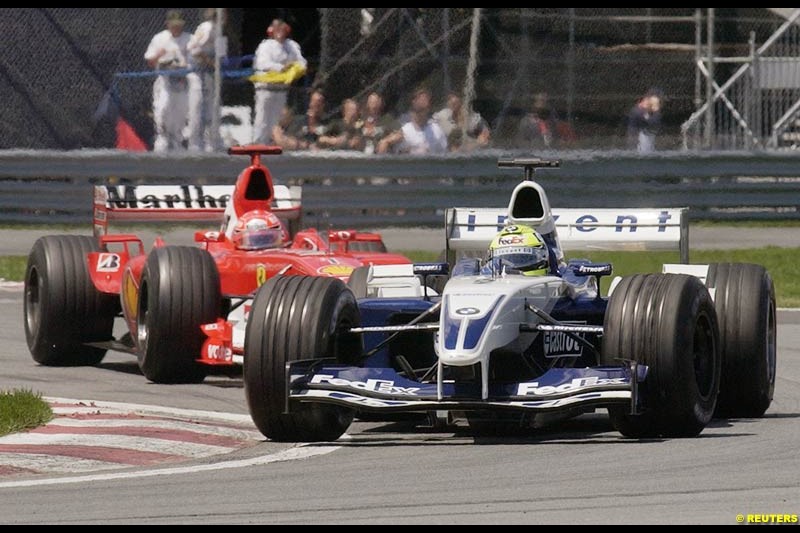 Ralf Schumacher, Williams, leads Michael Schumacher, Ferrari. Canadian Grand Prix, Montreal, Sunday, June 15th 2003.