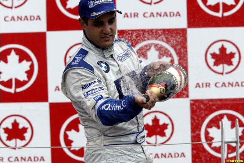 The Podium. Juan Pablo Montoya, Williams, celebrates third place. Canadian Grand Prix, Montreal, Sunday, June 15th 2003.