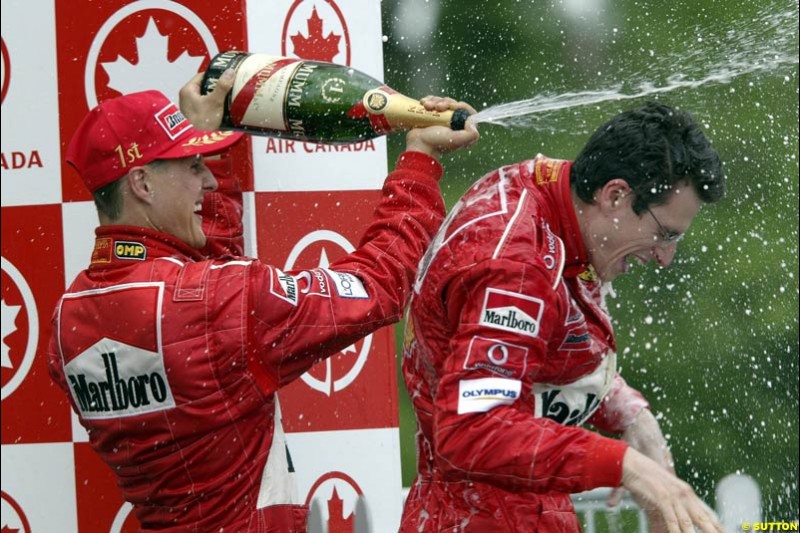 The Podium. Michael Schumacher, Ferrari, celebrates victory with race engineer, Chris Dyer. Canadian Grand Prix, Montreal, Sunday, June 15th 2003.