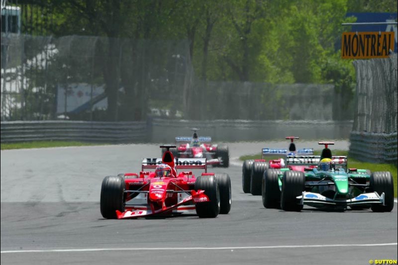 Rubens Barrichello, Ferrari, holds off the field as he limps to the pits with a broken front wing. Canadian Grand Prix, Montreal, Sunday, June 15th 2003.