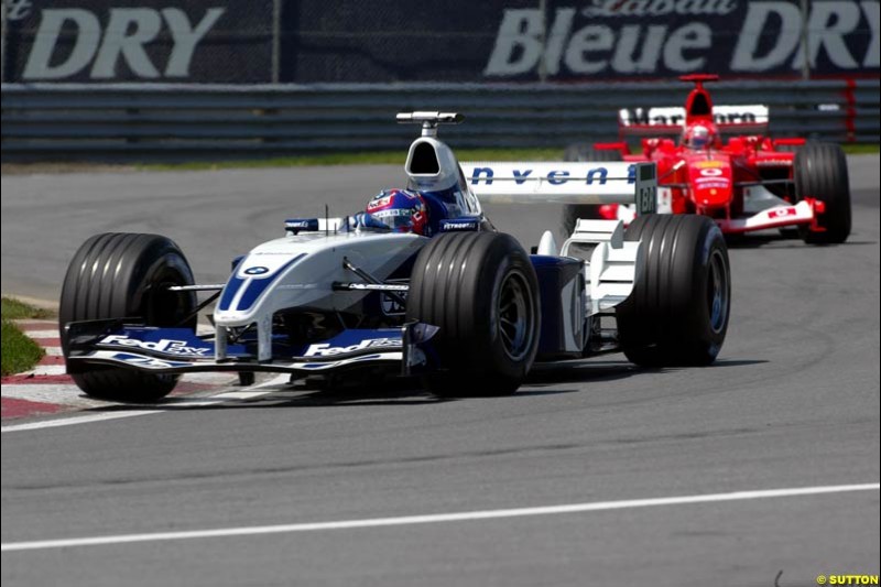 Juan Pablo Montoya, Williams, followed by Michael Schumacher, Ferrari. Canadian Grand Prix, Montreal, Sunday, June 15th 2003.