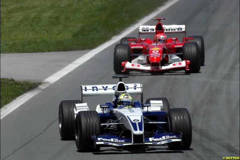 Ralf Schumacher, Williams, leads brother Michael Schumacher, Ferrari. Canadian Grand Prix, Montreal, Sunday, June 15th 2003.