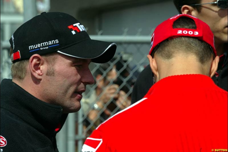 Jos Verstappen, Minardi, chats to Michael Schumacher, Ferrari. Canadian Grand Prix, Montreal, Sunday, June 15th 2003.