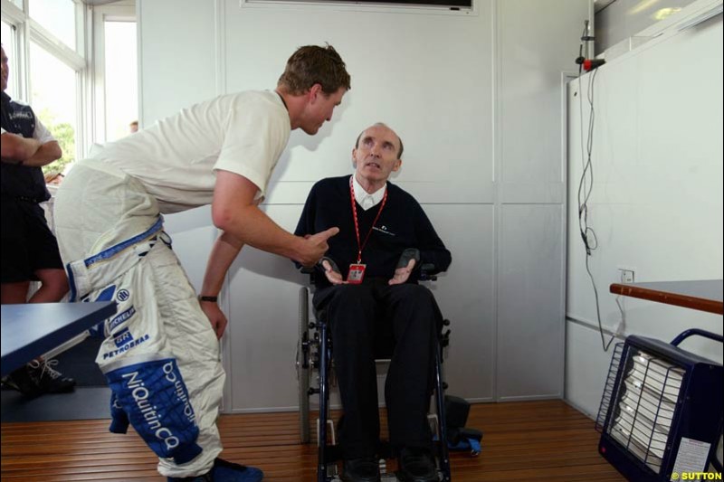 Ralf Schumacher, Williams, talks to Team Principal Frank Williams. French Grand Prix at Magny Cours. Circuit de Nevers, France. Sunday, July 6th 2003.