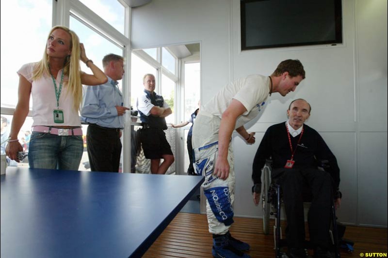 Ralf Schumacher, Williams, talks to Team Principal Frank Williams. French Grand Prix at Magny Cours. Circuit de Nevers, France. Sunday, July 6th 2003.