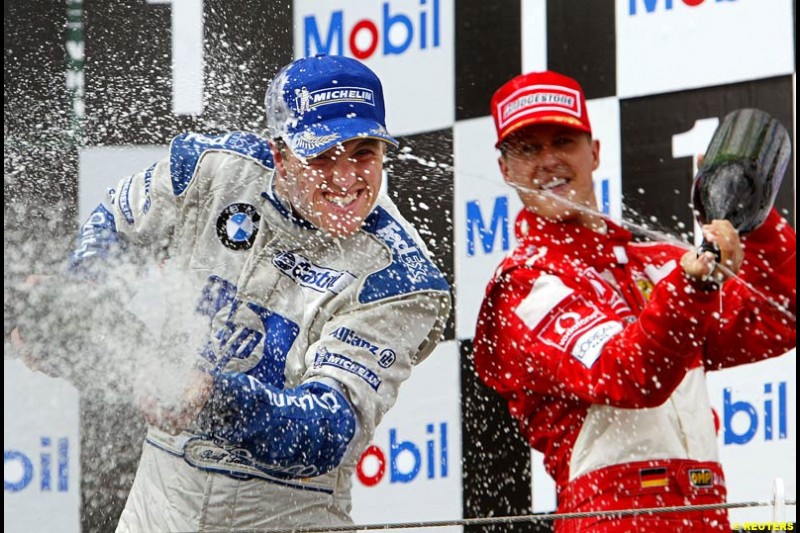 The podium of the French Grand Prix at Magny Cours. Circuit de Nevers, France. Sunday, July 6th 2003.