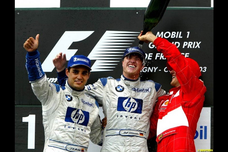 The podium of the French Grand Prix at Magny Cours. Circuit de Nevers, France. Sunday, July 6th 2003.