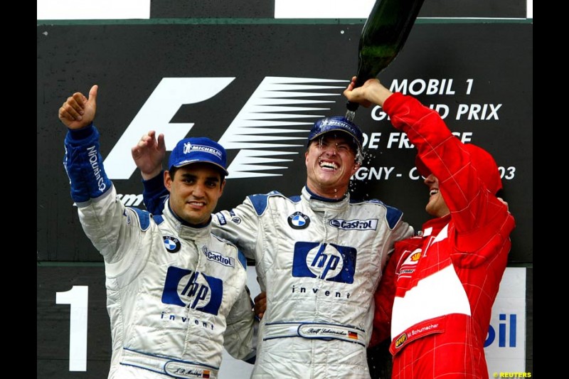 The podium of the French Grand Prix at Magny Cours. Circuit de Nevers, France. Sunday, July 6th 2003.
