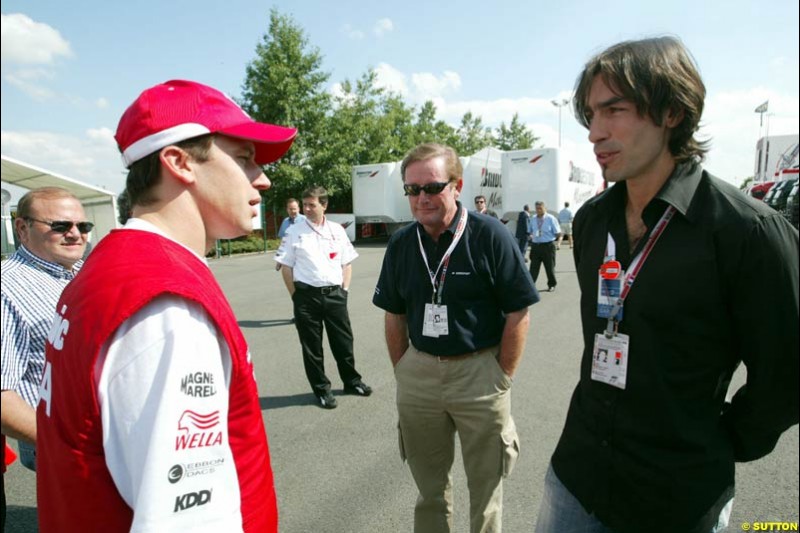 Olivier Panis with footballer Robert Pirez. French Grand Prix at Magny Cours, France. Sunday, July 6th 2003.