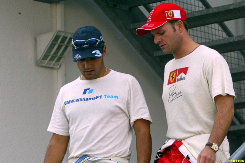 Juan Pablo Montoya, Williams, with Rubens Barrichello, Ferrari. German Grand Prix, Hockenheim, Germany. Saturday, August 2nd 2003.