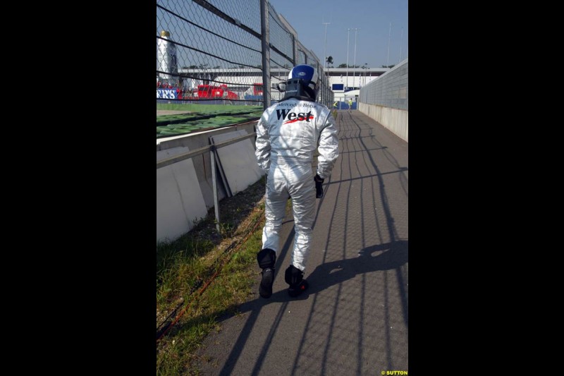 David Coulthard runs back to the pits after he crashed during practice. German Grand Prix, Hockenheim, Germany. Saturday, August 2nd 2003.