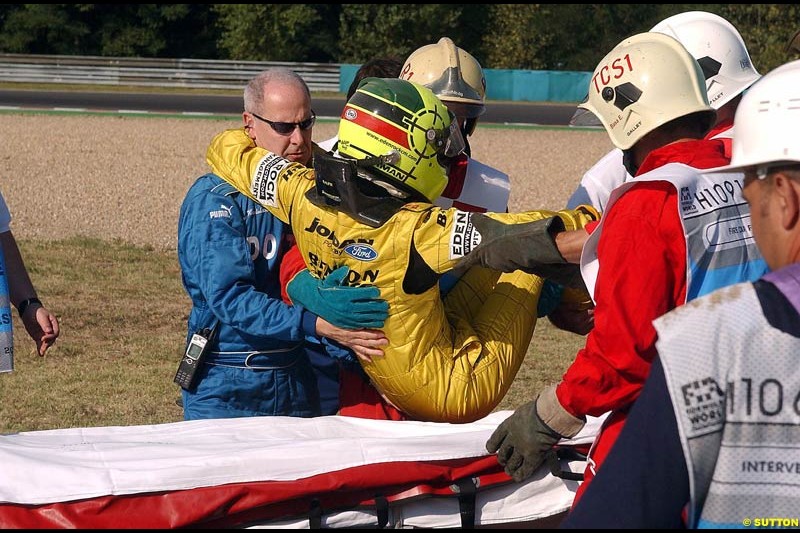 Ralph Firman Jnr, Jordan, is helped after crashing out of Free Practice. Hungarian Grand Prix Saturday. Hungaroring, Budapest. 23rd August, 2003.