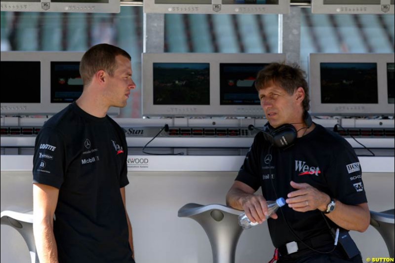 McLaren Test Driver Alex Wurz talks to Mario Illien, Ilmor Engine Designer. Hungarian Grand Prix Saturday. Hungaroring, Budapest. 23rd August, 2003.