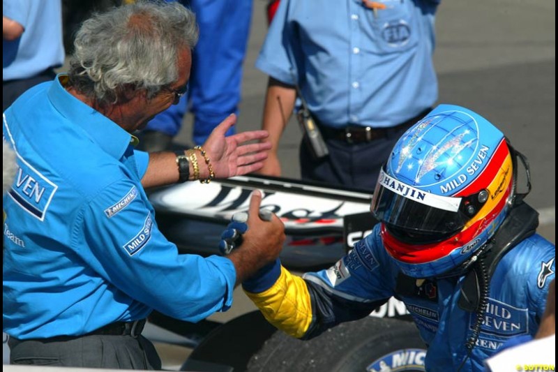 Fernando Alonso, Renault, celebrates victory. Hungarian Grand Prix Sunday. Hungaroring, Budapest. 24th August, 2003.