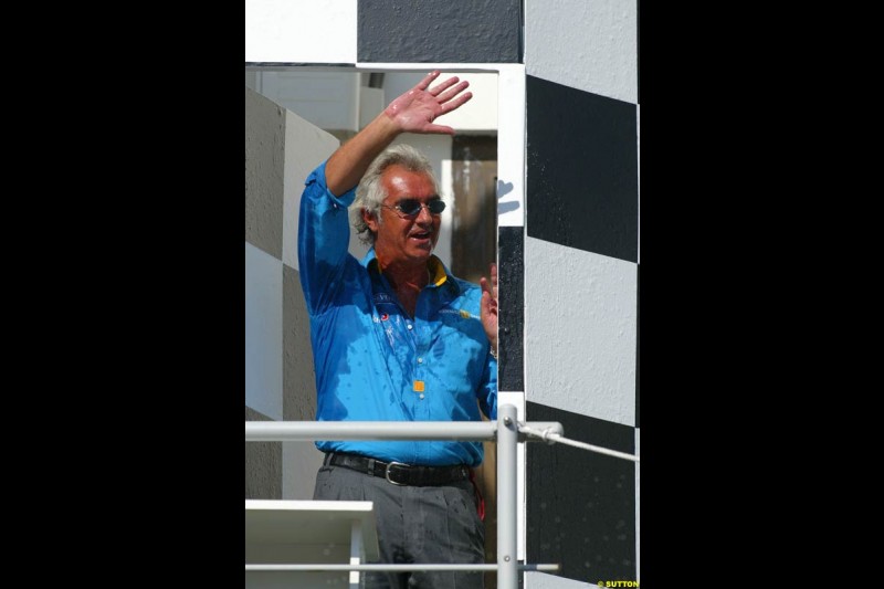 Flavio Briatore, Renault Team Principle, celebrates on the podium. Hungarian Grand Prix Sunday. Hungaroring, Budapest. 24th August, 2003.