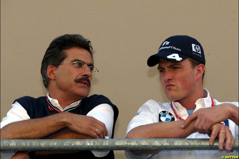 Mario Theissen and Ralf Schumacher. United States GP, Indianapolis Motor Speeway. Thursday, September 25th 2003.