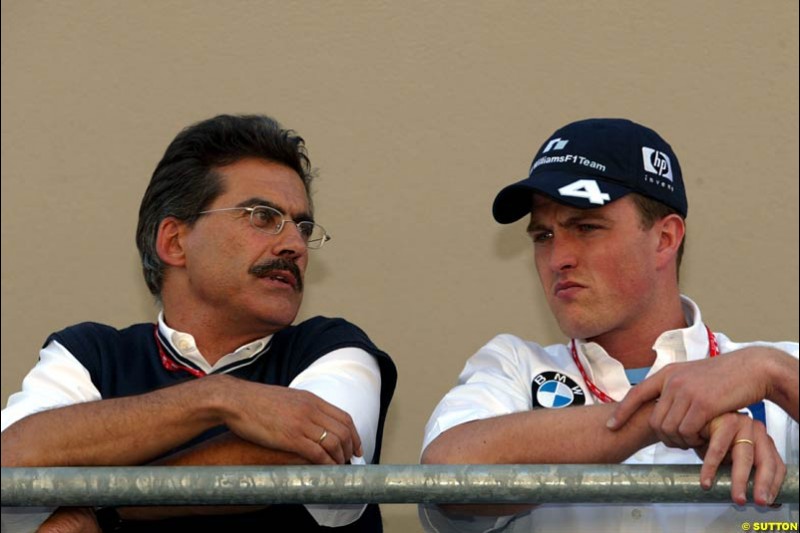 Mario Theissen and Ralf Schumacher. United States GP, Indianapolis Motor Speeway. Thursday, September 25th 2003. 
