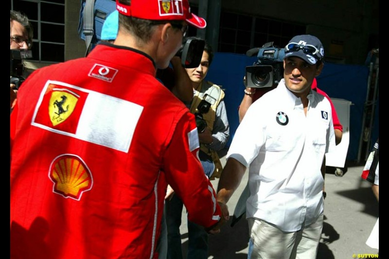 Michael Schumacher and Juan Pablo Montoya. United States GP, Indianapolis Motor Speeway. Thursday, September 25th 2003.
