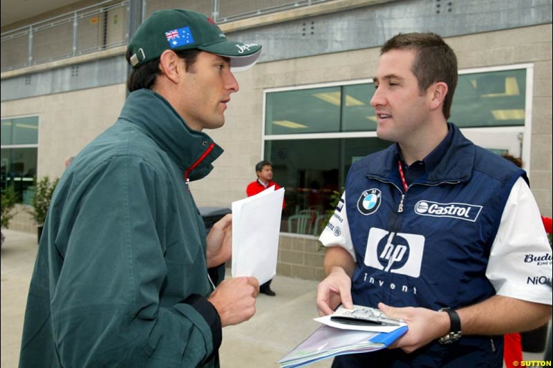 Mark Webber with Chris Styring, Williams account manager. United States GP, Indianapolis Motor Speeway. Sunday, September 29th 2003.