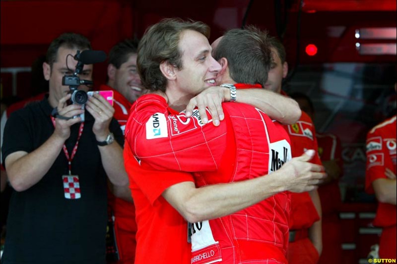 Luca Badoer congratulates polle sitter Rubens Barrichello. Japanese Grand Prix, Suzuka, Japan. Saturday, October 11th 2003.