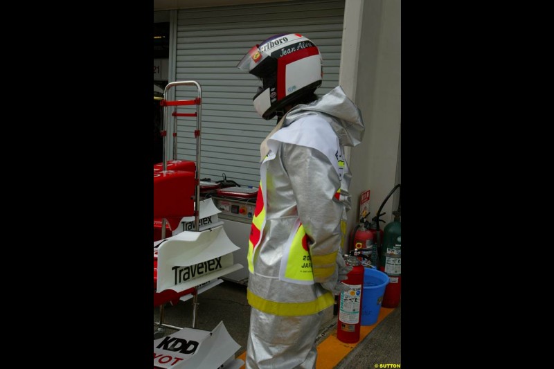 Fire marshal wearing an Alesi helmet. Japanese Grand Prix, Suzuka, Japan. Saturday, October 11th 2003.