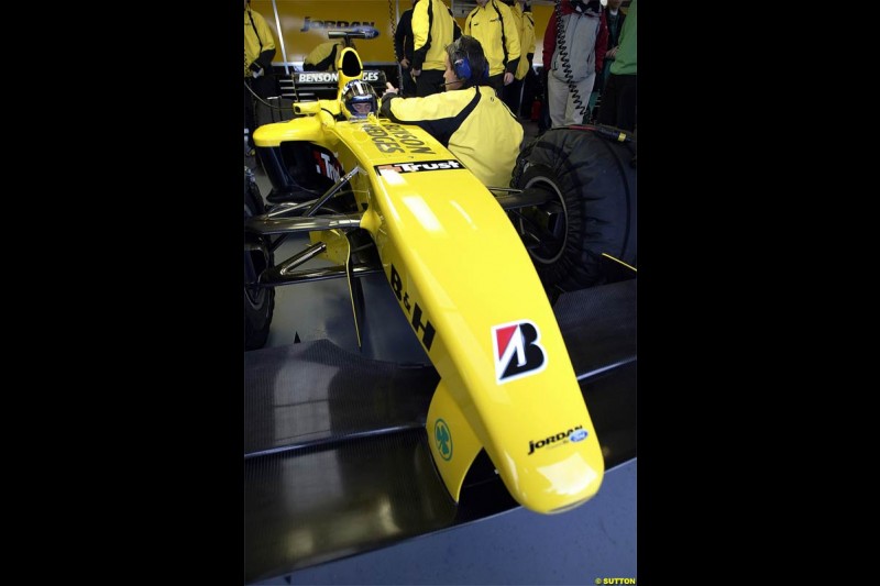 Nick Heidfeld waits to test the new Jordan EJ14 at Silverstone. February 2 2004.