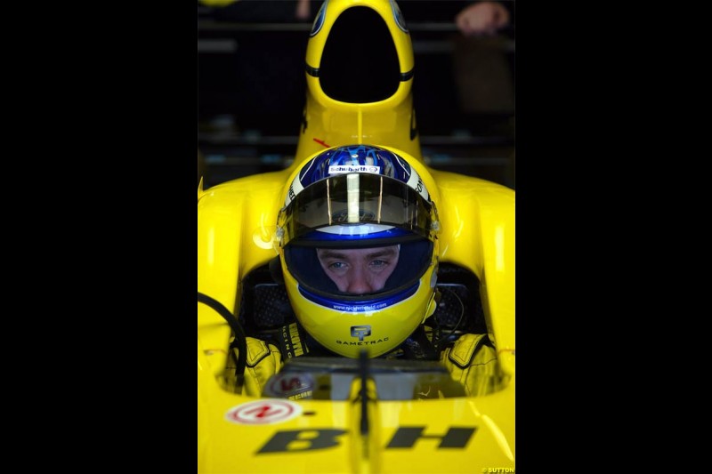 Nick Heidfeld waits to test the new Jordan EJ14 at Silverstone. February 2 2004. 