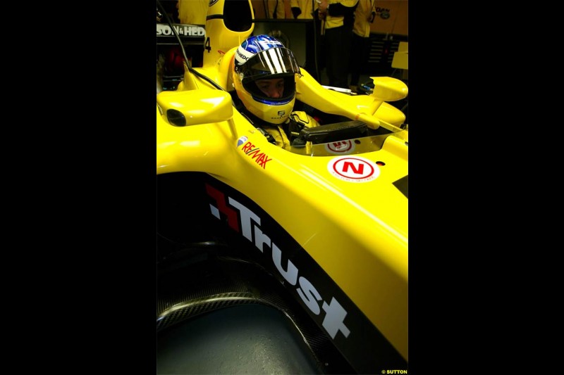 Nick Heidfeld waits to test the new Jordan EJ14 at Silverstone. February 2 2004. 