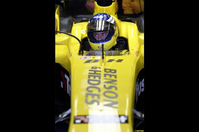 Nick Heidfeld waits to test the new Jordan EJ14 at Silverstone. February 2 2004. 