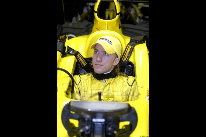 Nick Heidfeld waits to test the new Jordan EJ14 at Silverstone. February 2 2004. 