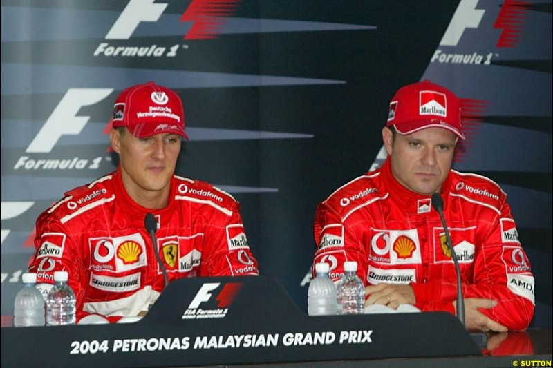 Michael Schumacher and Rubens Barrichello in the post-qualifying press conference. Saturday qualifying for the Malaysian Grand Prix. Sepang, Kuala Lumpur, Malaysia. March 20th 2004.