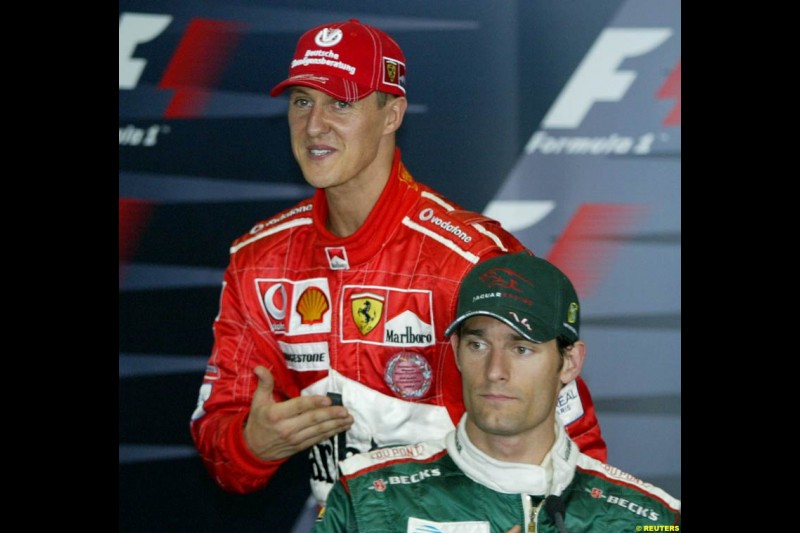 Michael Schumacher and Mark Webber in the post-qualifying press conference. Saturday qualifying for the Malaysian Grand Prix. Sepang, Kuala Lumpur, Malaysia. March 20th 2004.