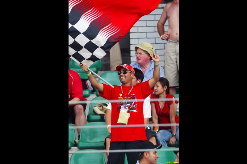 Tifosi celebrate. Saturday qualifying for the Malaysian Grand Prix. Sepang, Kuala Lumpur, Malaysia. March 20th 2004.