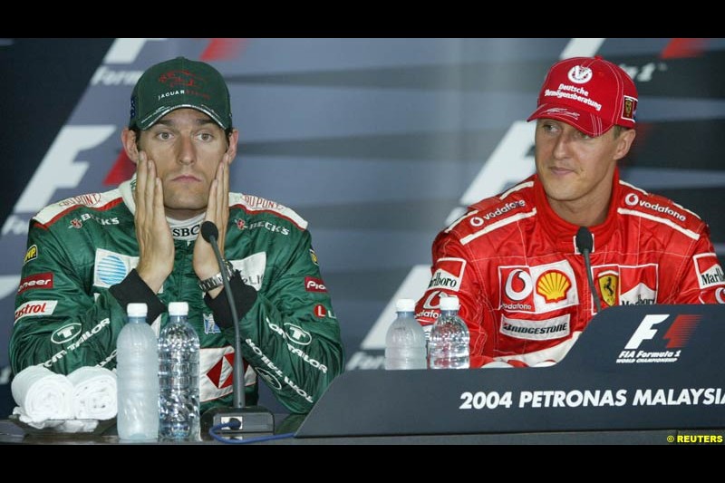Mark Webber and Michael Schumacher in the post-qualifying press conference. Saturday qualifying for the Malaysian Grand Prix. Sepang, Kuala Lumpur, Malaysia. March 20th 2004.