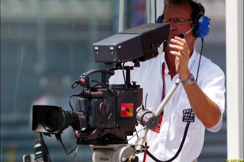 FOM cameraman. Saturday qualifying for the Malaysian Grand Prix. Sepang, Kuala Lumpur, Malaysia. March 20th 2004.