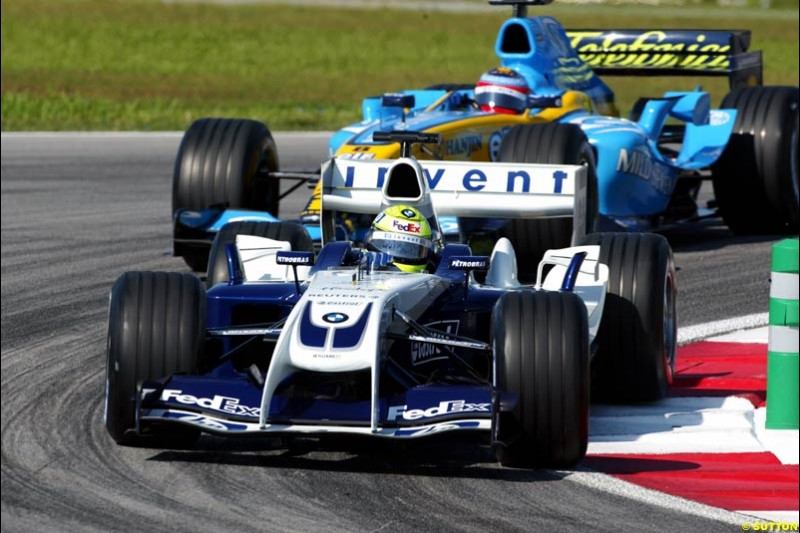 Ralf Schumacher, Williams, followed by Fernando Alonso, Renault. Saturday practice for the Malaysian Grand Prix. Sepang, Kuala Lumpur, Malaysia. March 20th 2004.