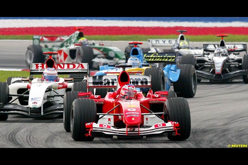 The first corner. The Malaysian Grand Prix. Sepang, Kuala Lumpur, Malaysia. March 21st, 2004.