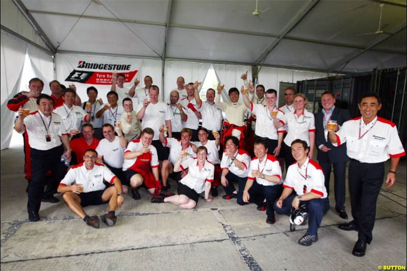 Bridgestone celebrate victory. The Malaysian Grand Prix. Sepang, Kuala Lumpur, Malaysia. March 21st 2004.