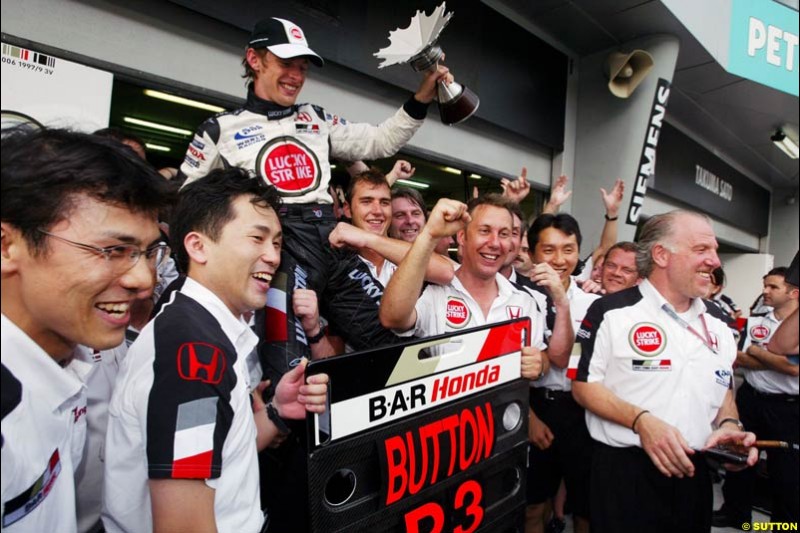 BAR Team Photo. Jenson Button, BAR, celebrates third place. The Malaysian Grand Prix. Sepang, Kuala Lumpur, Malaysia. March 21st 2004.