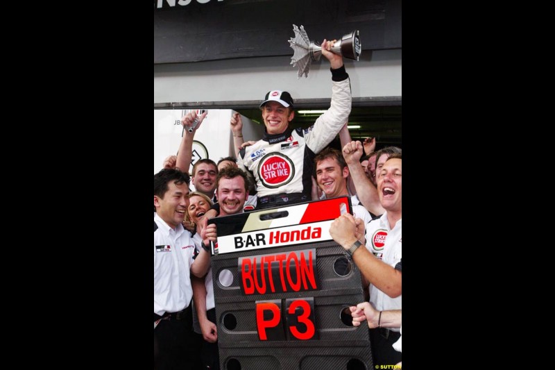 BAR Team Photo. Jenson Button, BAR, celebrates third place. The Malaysian Grand Prix. Sepang, Kuala Lumpur, Malaysia. March 21st 2004.