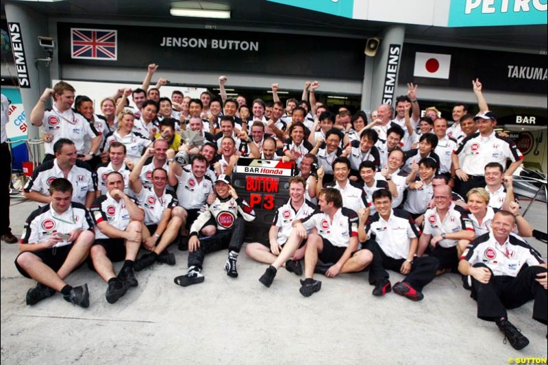 BAR Team Photo. Jenson Button, BAR, celebrates third place. The Malaysian Grand Prix. Sepang, Kuala Lumpur, Malaysia. March 21st 2004.