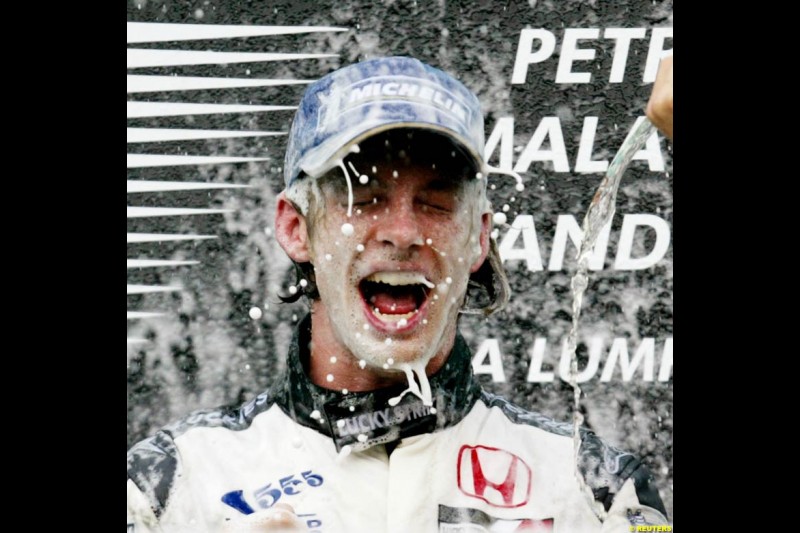 Jenson Button, BAR, celebrates third place. The Malaysian Grand Prix. Sepang, Kuala Lumpur, Malaysia. March 21st 2004.