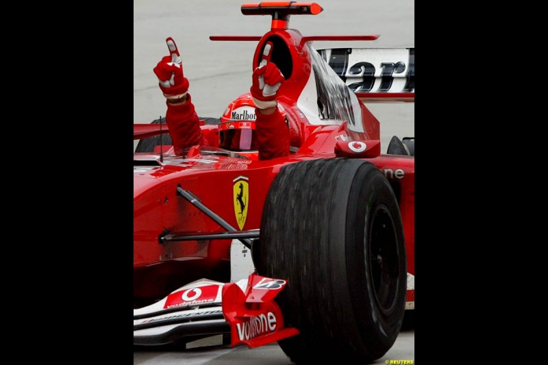 Michael Schumacher, Ferrari, celebrates victory. The Malaysian Grand Prix. Sepang, Kuala Lumpur, Malaysia. March 21st 2004.