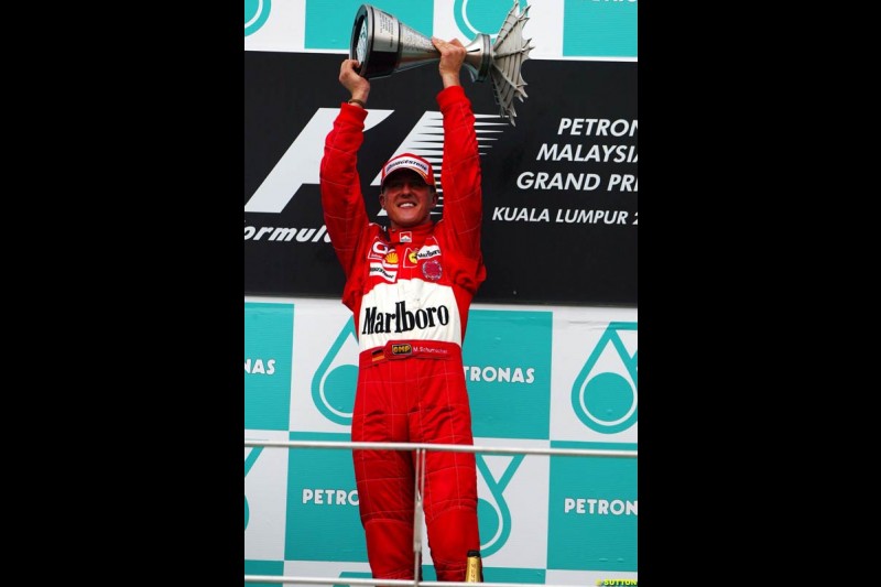 Michael Schumacher, Ferrari, celebrates victory. The Malaysian Grand Prix. Sepang, Kuala Lumpur, Malaysia. March 21st 2004.