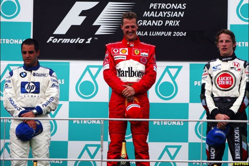 The Podium. 1st, Michael Schumacher, Ferrari; 2nd, Juan Pablo Montoya, Williams; 3rd, Jenson Button, BAR. The Malaysian Grand Prix. Sepang, Kuala Lumpur, Malaysia. March 21st 2004.