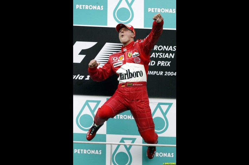 Michael Schumacher, Ferrari, celebrates victory. The Malaysian Grand Prix. Sepang, Kuala Lumpur, Malaysia. March 21st 2004.