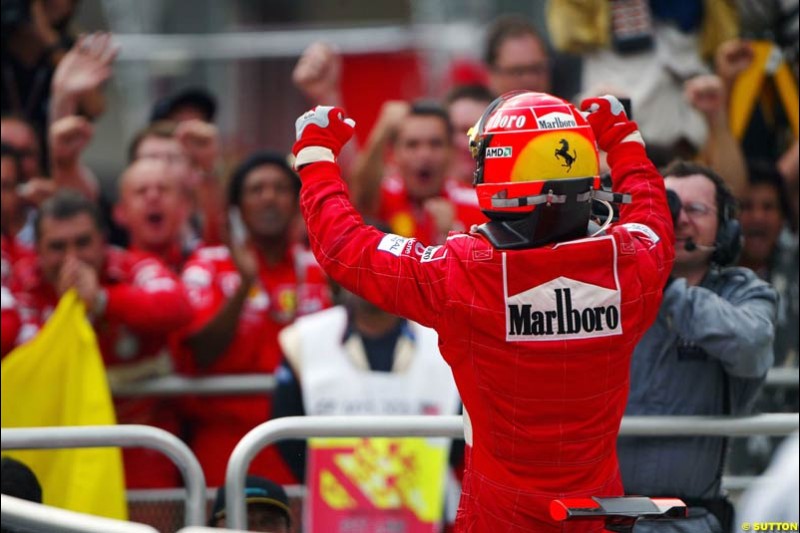 Michael Schumacher, Ferrari, celebrates victory. The Malaysian Grand Prix. Sepang, Kuala Lumpur, Malaysia. March 21st 2004.